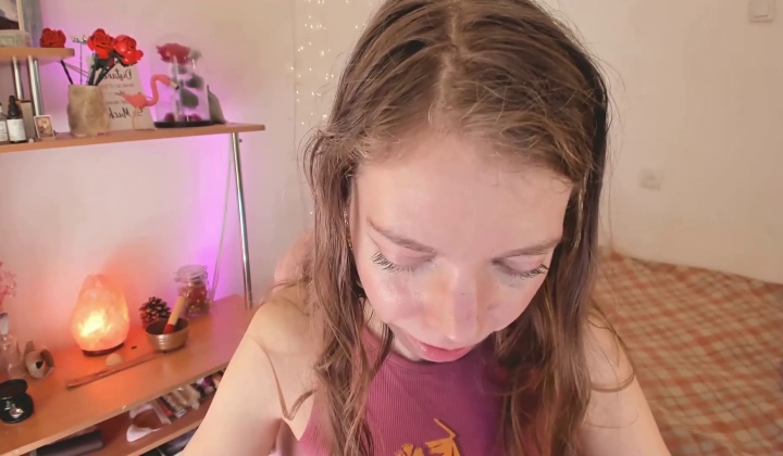 close up of girl pulling down skirt to expose vulva  ?