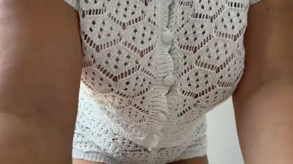 A beauty with big tits and a big ass tries on sheer blouse