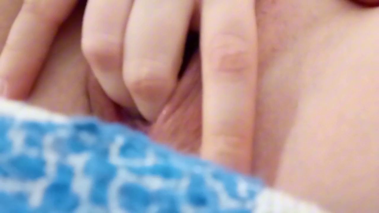 dilating her vagina with a dildo